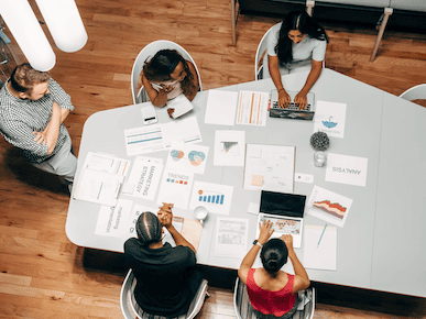 A picture of people working together.