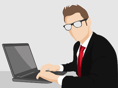 A picture of a man working on his computer.