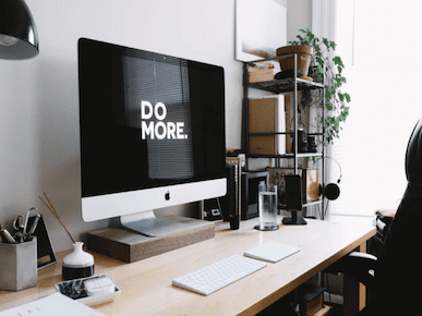 A picture of a iMac with text saying, 'Do More'.