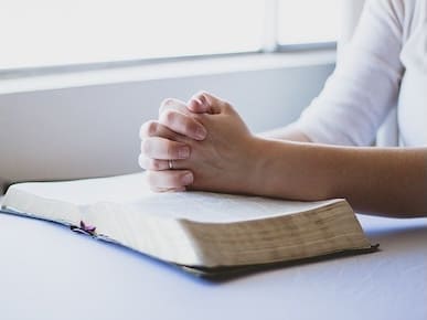 A picture of a person praying.